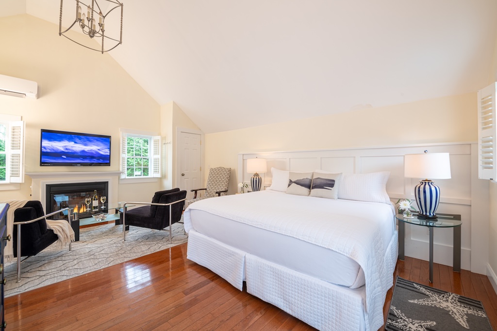 Stay at the best Bed and Breakfast on Cape Cod and enjoy this room featuring a fireplace, sitting area, and king sized bed. 