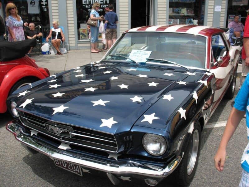 an old car painted like the american flag