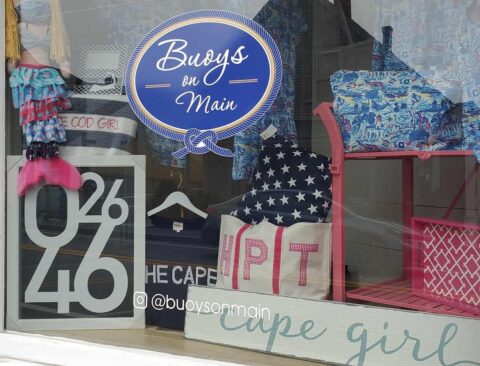 A storefront window display nautical themed items